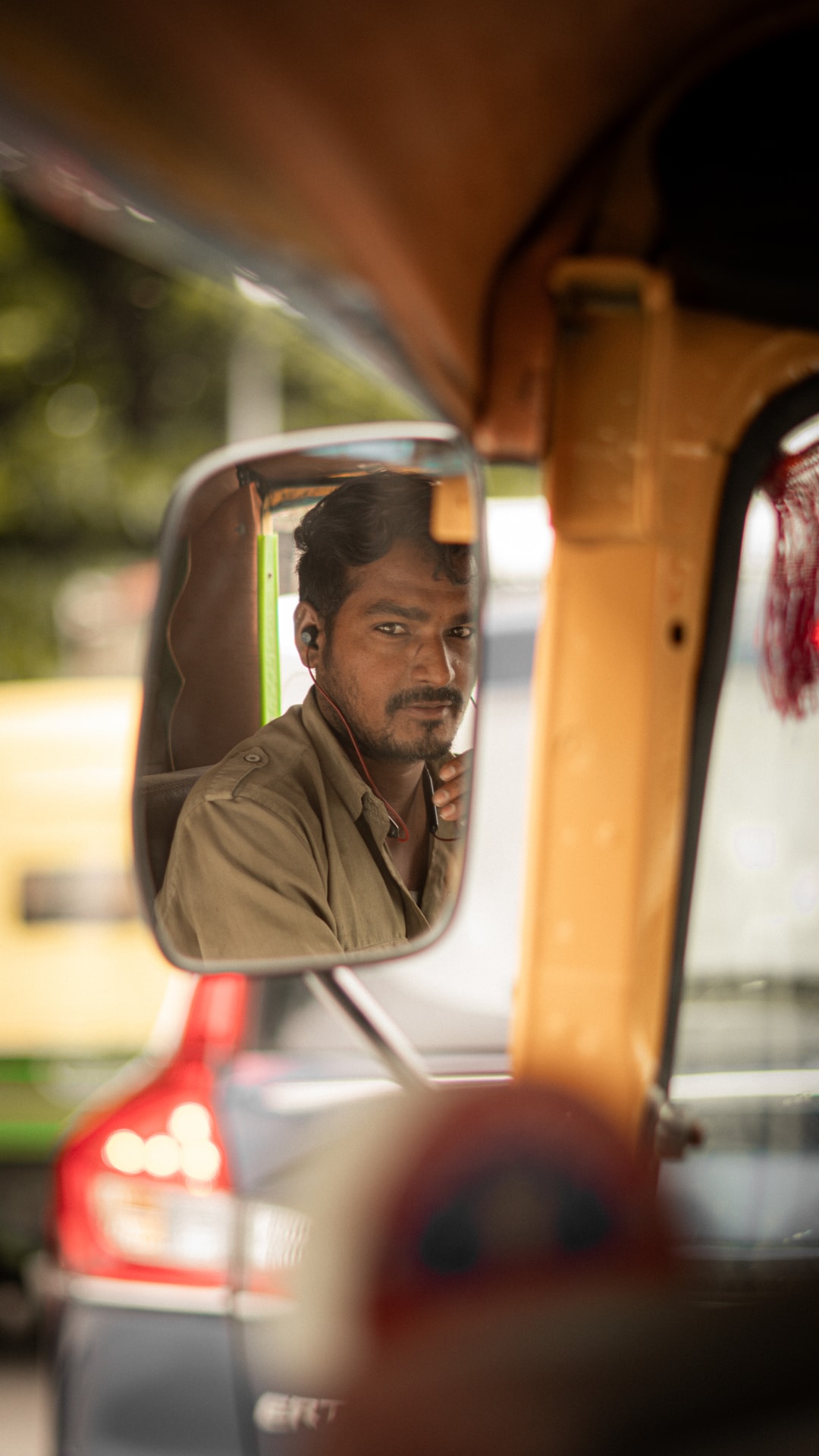 Auto driver seen through mirror